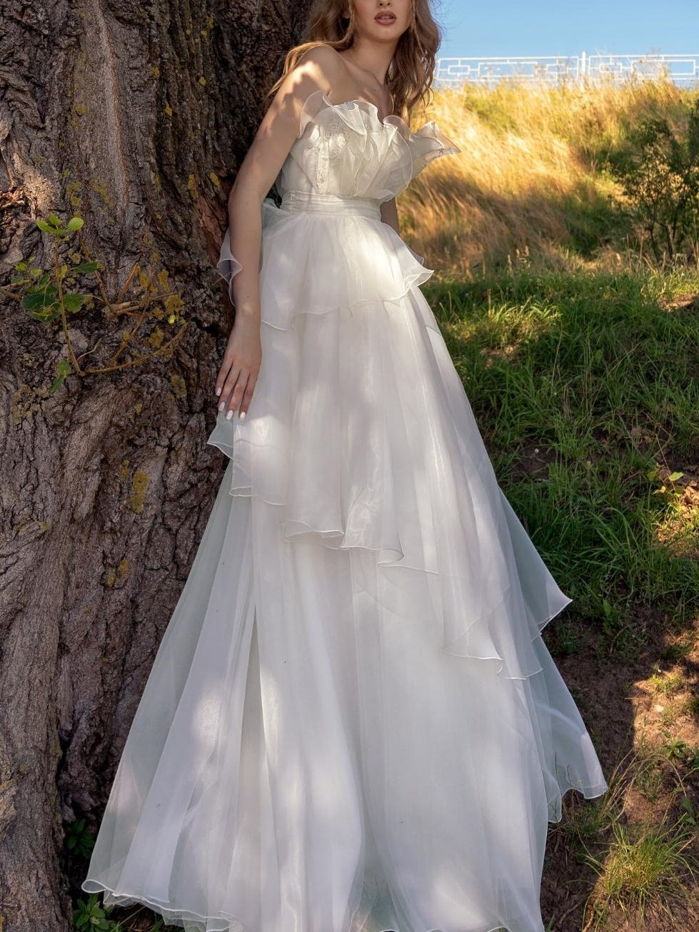 A-Line/Princess Strapless sleeveless Floor-Length Wedding Dress with Ruffles